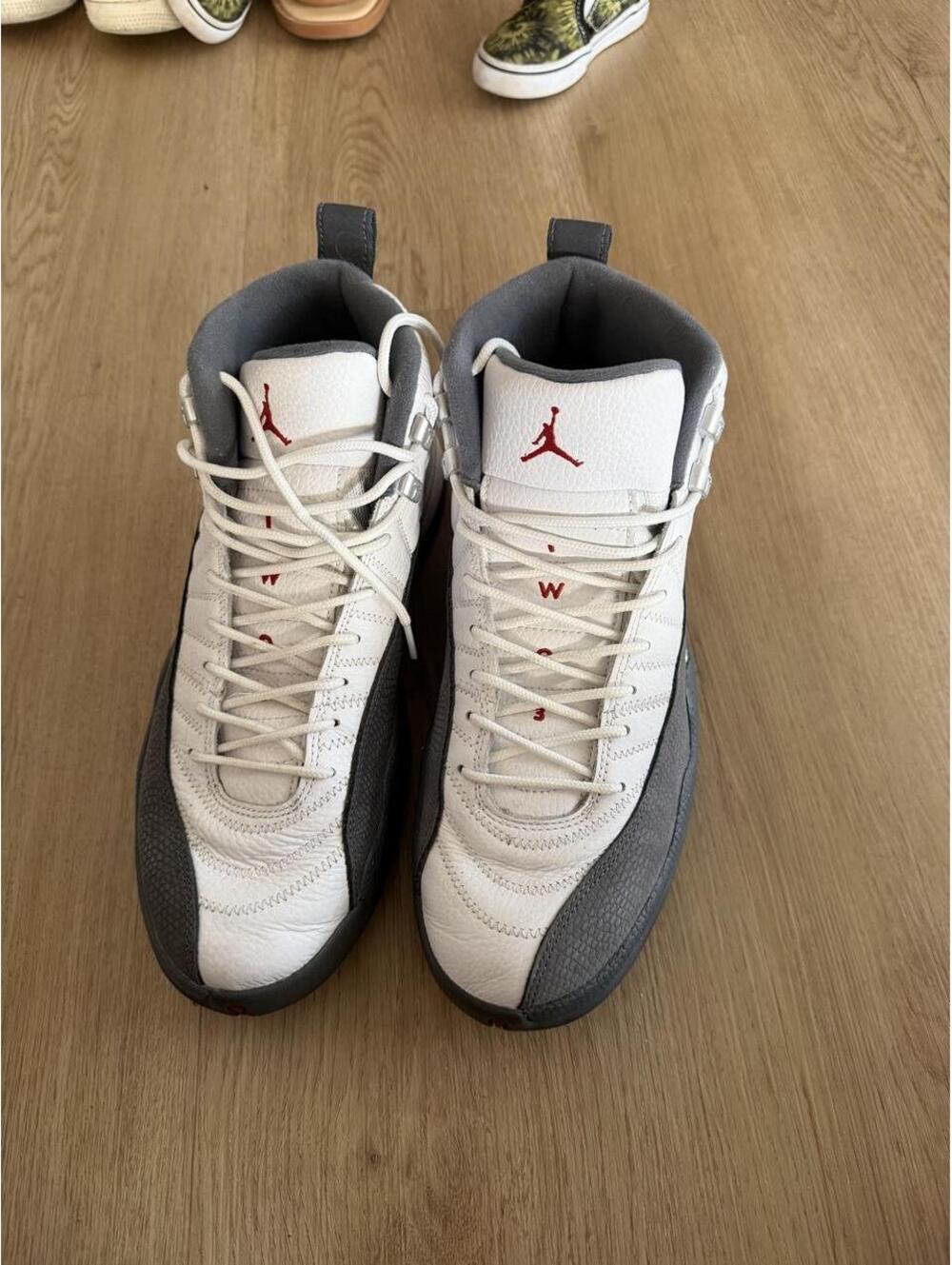 Jordan 12 Retro white and gray sneakers